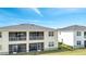 Two-story house with screened balcony and fenced backyard at 543 Ocean Course Ave, Davenport, FL 33896