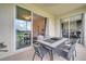 Covered lanai with seating area and golf course view at 543 Ocean Course Ave, Davenport, FL 33896