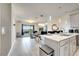 Open concept kitchen with island and dining area at 543 Ocean Course Ave, Davenport, FL 33896