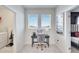 Upstairs home office with two windows and a desk at 543 Ocean Course Ave, Davenport, FL 33896