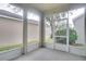 Screened porch overlooking backyard at 7041 Buttonbush Loop, Harmony, FL 34773