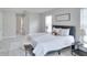 Main bedroom with a plush bed and plenty of natural light at 7041 Buttonbush Loop, Harmony, FL 34773