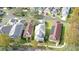 Aerial view of a neighborhood featuring various house styles and landscaping at 7041 Buttonbush Loop, Harmony, FL 34773