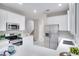 Bright kitchen with white cabinets, stainless steel appliances, and an island at 7041 Buttonbush Loop, Harmony, FL 34773