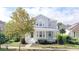 Two-story craftsman home with a front porch and landscaped yard at 7041 Buttonbush Loop, Harmony, FL 34773
