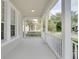 Spacious front porch overlooking a tree-lined street at 7041 Buttonbush Loop, Harmony, FL 34773
