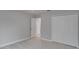 Well-lit bedroom with double door closet and neutral carpeting at 7041 Buttonbush Loop, Harmony, FL 34773