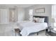 Main bedroom with a plush bed and plenty of natural light at 7041 Buttonbush Loop, Harmony, FL 34773