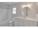 Clean bathroom featuring a white vanity and bathtub at 7041 Buttonbush Loop, Harmony, FL 34773