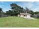 Large backyard with detached garage and spacious grassy area at 110 Angeles Rd, Debary, FL 32713