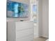 Bedroom with white dresser and mounted TV at 3955 Lana Ave, Davenport, FL 33897