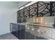 Outdoor kitchen with stainless steel grill and granite countertops at 3955 Lana Ave, Davenport, FL 33897