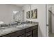 Double vanity bathroom with granite countertops and a walk-in shower at 3955 Lana Ave, Davenport, FL 33897