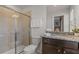 Clean bathroom with granite countertop, walk-in shower, and modern vanity at 3955 Lana Ave, Davenport, FL 33897