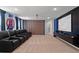 Home theater with reclining seats and Avengers-themed decor at 3955 Lana Ave, Davenport, FL 33897