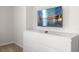 White dresser with six drawers and a mounted TV at 3955 Lana Ave, Davenport, FL 33897
