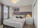 Bedroom with grey headboard and modern decor at 3955 Lana Ave, Davenport, FL 33897