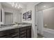 Bathroom with granite countertop double vanity and shower/tub combo at 3955 Lana Ave, Davenport, FL 33897