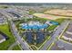 Aerial view of community with resort-style pool, tennis courts, and playground at 3955 Lana Ave, Davenport, FL 33897