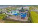Community pool and playground with shade structures and landscaping at 5045 Rain Shadow Dr, St Cloud, FL 34772