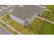 Two-story house with gray exterior, a fenced backyard, and a side view at 5045 Rain Shadow Dr, St Cloud, FL 34772