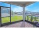 Relaxing screened patio overlooking the backyard and neighborhood at 5045 Rain Shadow Dr, St Cloud, FL 34772