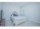 Spacious bedroom with a queen-size bed and gray carpet at 5045 Rain Shadow Dr, Saint Cloud, FL 34772