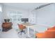 Home office with a desk, chairs, and neutral decor at 5045 Rain Shadow Dr, St Cloud, FL 34772