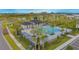 Community pool with cabana, landscaping, and surrounding homes at 5045 Rain Shadow Dr, St Cloud, FL 34772