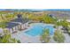 Aerial view of community pool with a large deck and a shaded seating area at 5045 Rain Shadow Dr, St Cloud, FL 34772