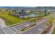 Community pool, playground, and cabana with surrounding landscape at 5045 Rain Shadow Dr, St Cloud, FL 34772