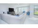 Spacious living room with sectional sofa and large TV at 5045 Rain Shadow Dr, St Cloud, FL 34772
