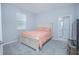 Bedroom with a double bed, light peach bedding, and an ensuite bathroom at 5045 Rain Shadow Dr, St Cloud, FL 34772