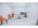 Home office with a desk, chairs, and neutral decor at 5045 Rain Shadow Dr, St Cloud, FL 34772