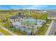 Resort-style community pool with a cabana and palm trees at 5045 Rain Shadow Dr, St Cloud, FL 34772