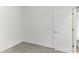 Empty bedroom with grey carpet and a closet at 502 Kennedy Dr, Lake Alfred, FL 33850