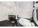 Elegant bathroom with marble tile and hexagonal floors at 627 Largovista Dr, Oakland, FL 34787