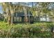 Charming two-story home with mature landscaping and red front door at 706 E Pine St # 5, Orlando, FL 32801