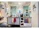 Small galley kitchen with teal tile and stainless steel appliances at 706 E Pine St # 5, Orlando, FL 32801