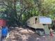Area with RV parked, surrounded by trees and debris at 780 Snow Hill Rd, Geneva, FL 32732