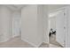 Hallway with doors to bedrooms and bathroom at 1178 Michelangelo Ln, Winter Haven, FL 33884