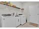 Laundry room with washer, dryer, and utility sink at 1178 Michelangelo Ln, Winter Haven, FL 33884