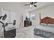 Spacious bedroom with a large bed, TV, and ensuite bathroom at 1178 Michelangelo Ln, Winter Haven, FL 33884