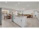 Open concept kitchen with island and stainless steel appliances at 1178 Michelangelo Ln, Winter Haven, FL 33884