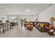 Open living room with large sectional sofa and tile floors at 1178 Michelangelo Ln, Winter Haven, FL 33884