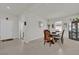 Bright dining room with a wooden table and four chairs at 1178 Michelangelo Ln, Winter Haven, FL 33884