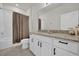 Clean bathroom with granite countertop, white cabinets, and a shower/tub combo at 1178 Michelangelo Ln, Winter Haven, FL 33884