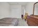 Cozy bedroom with striped bedding and a wooden dresser at 1178 Michelangelo Ln, Winter Haven, FL 33884