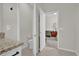 Small bathroom with toilet and view into bedroom at 1178 Michelangelo Ln, Winter Haven, FL 33884