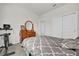 Bedroom with a double bed, dresser, and exercise bike at 1178 Michelangelo Ln, Winter Haven, FL 33884